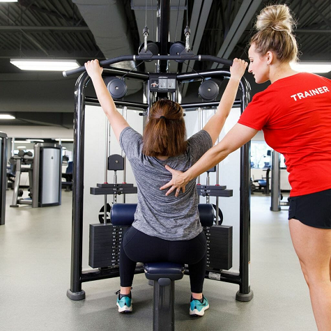 Trainer and client working out